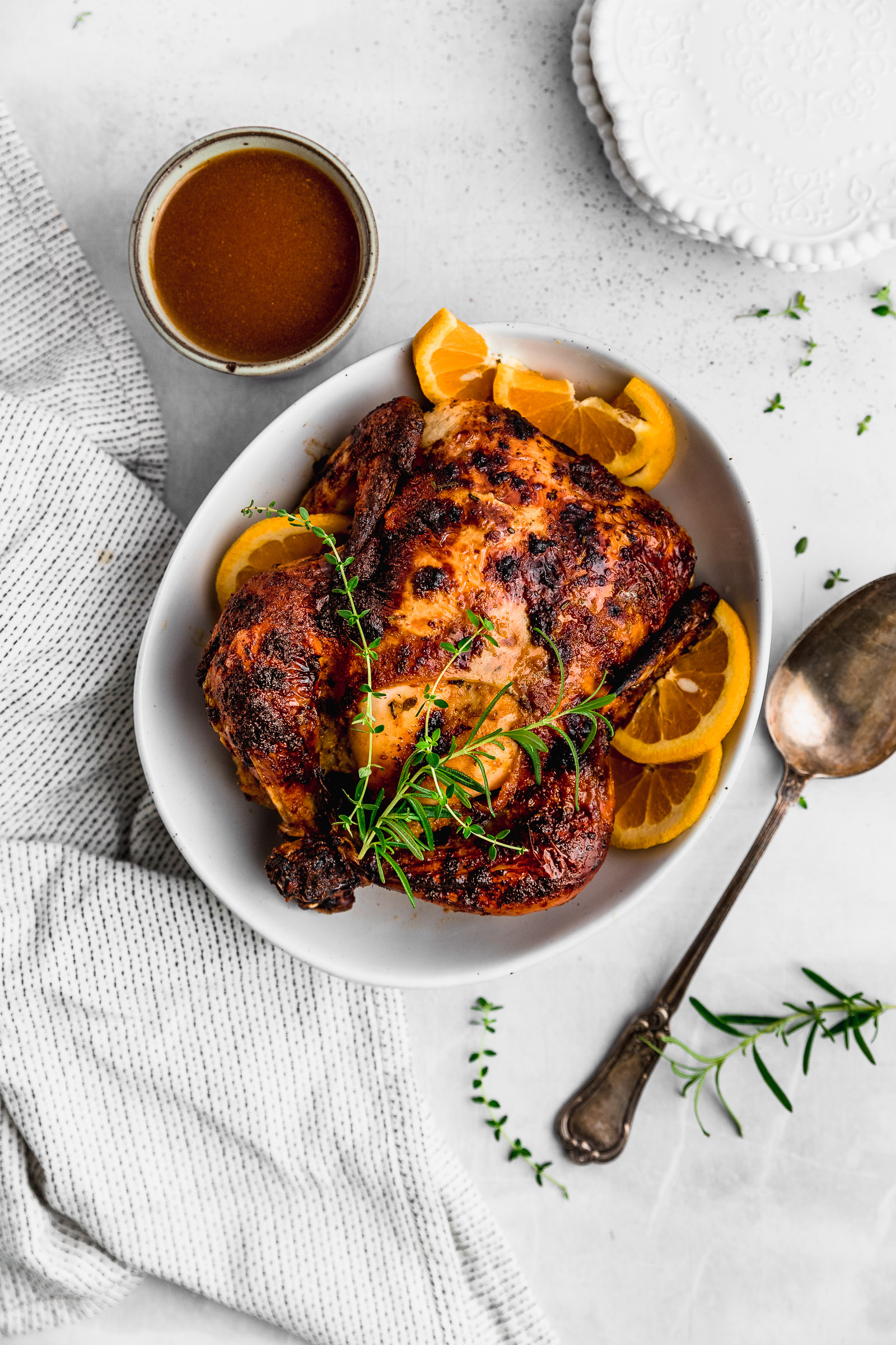 Whole Chicken Honey orange roasted chicken, serve with orange slices and sprigs of rosemary and thyme.
