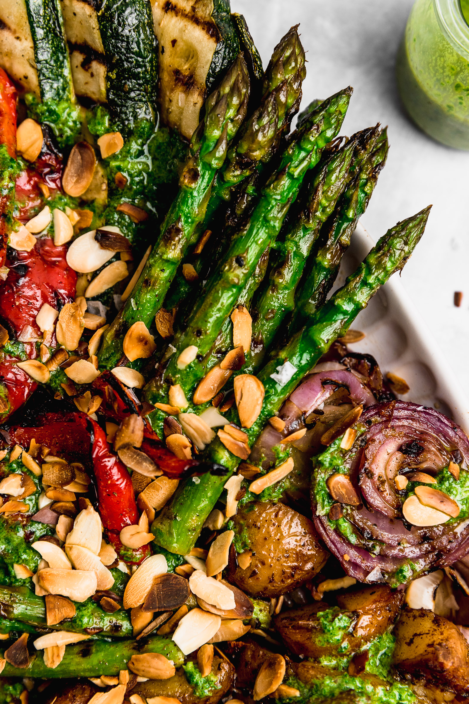 Zoom into a large platter of marinated grilled vegetables and you can see the details on the asparagus and onions, topped with a basil vinaigrette.