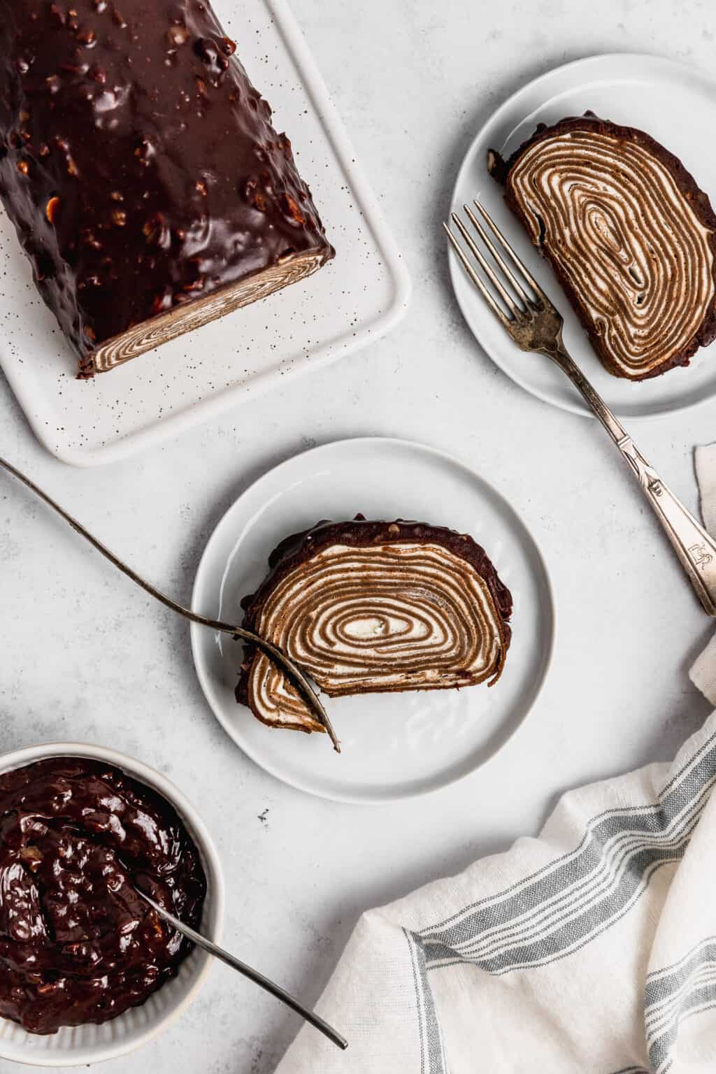 Chocolate Crepe Roll Cake Covered in Ganache | Cravings Journal